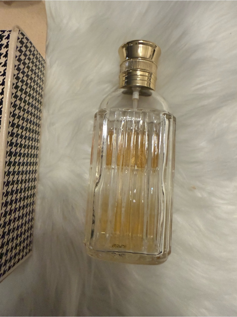 Black and Cream Houndstooth Patterned Box and empty bottle